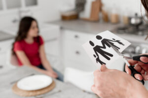 close-up-parent-cutting-paper-family-with-scissors.jpg