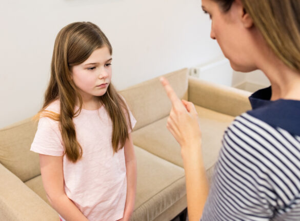 mother-scolding-her-daughter-living-room.jpg