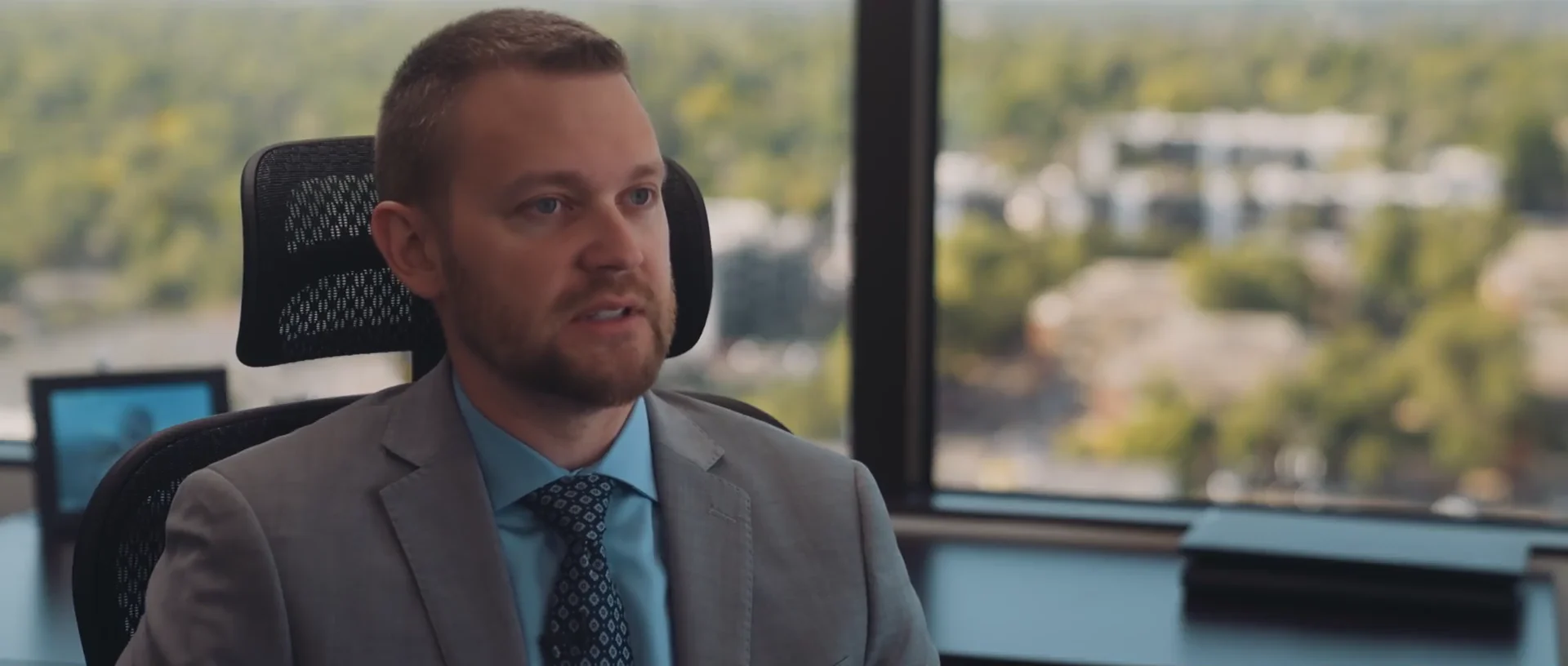 Reid DeChant speaking in his Denver law office in the firm's criminal defense and DUI video.